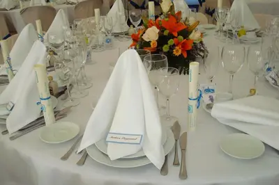 a table with white napkins and glasses on it at Hotel Los Perales in Puebla de Sanabria