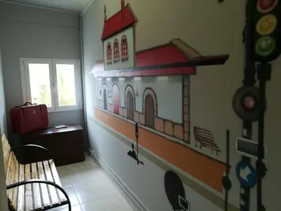 a room with a building mural on the wall at Pension Grilo in Padrón