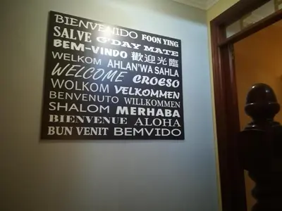 a wall with a sign on a wall at Pension Grilo in Padrón