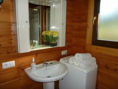 a bathroom with a sink and a toilet and a mirror at El Estudio in Ferreirós