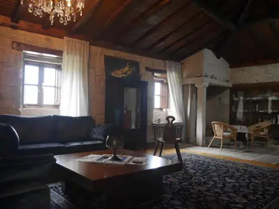 a living room with a couch and a coffee table at San Andres Ferienhaus mit Gästehaus in Parada del Sil
