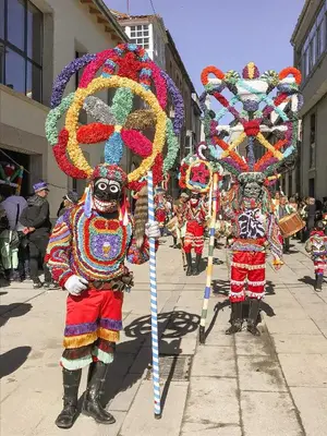 a group of people in costumes in a parade at Apartamento Las Medulas in Covas