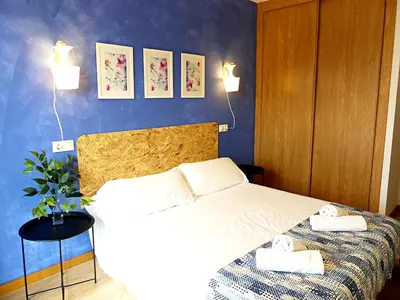 a bedroom with a bed with two towels on it at Masquestar Rías Altas in Foz