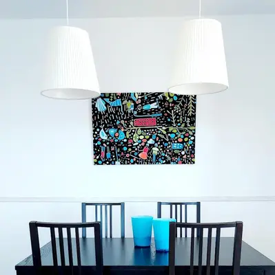 a dining room with a table with chairs and a painting at Masquestar Rías Altas in Foz