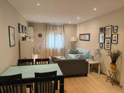 a living room with a couch and a table at Piso Ponferrada in Ponferrada