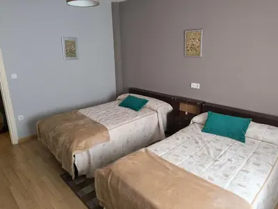 a room with two beds in a room at Piso Ponferrada in Ponferrada