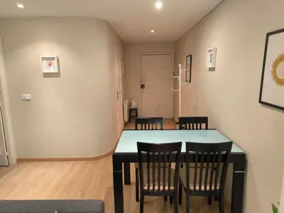 a dining room with a table and chairs at Piso Ponferrada in Ponferrada