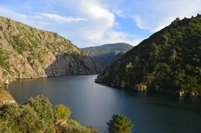 a view of a lake in a valley between two mountains at Hotel Casa Reboiro in Monforte de Lemos
