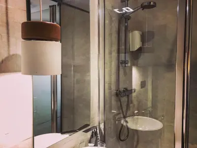 a bathroom with a shower and a sink at Casa do Maestro in Portomarin