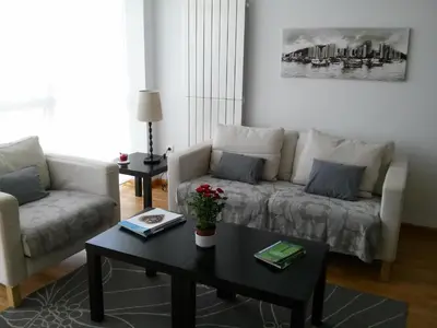 a living room with a couch and a coffee table at Apartamento Dicar in Foz