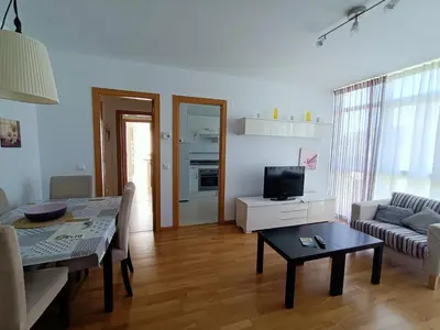 a living room with a couch and a table at Apartamento Dicar in Foz