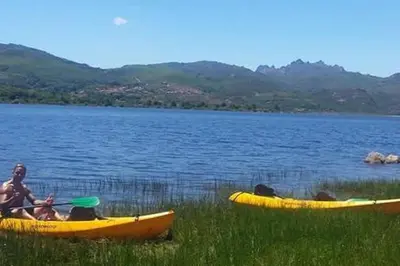 two people in yellow kayaks on a lake at Apartamento Carballo Do Xurès in Maus de Salas