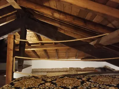 a bed in a room with a wooden ceiling at Apartamento Carballo Do Xurès in Maus de Salas