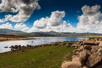 a large body of water with a bunch of rocks at Casa do Xurés in Maus de Salas