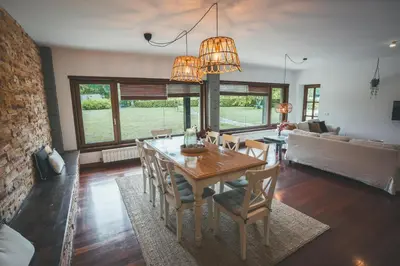 a dining room with a table and chairs at HolaCamp Camino in O Pino