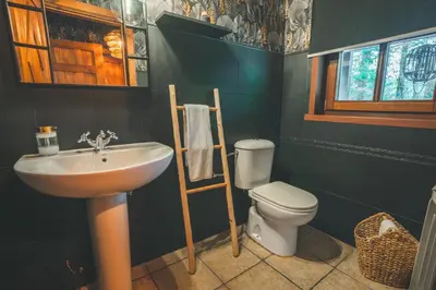 a bathroom with a sink and a toilet at HolaCamp Camino in O Pino