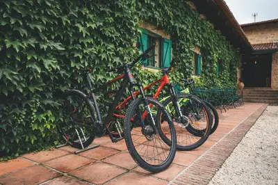 two bikes are parked next to a building at HolaCamp Camino in O Pino