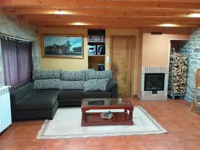 a living room with a couch and a coffee table at Casa dos Eiriz in Souto