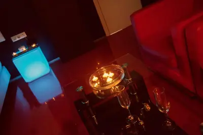 a table with candles and wine glasses on it at Motel Paraiso in Outeiro de Rei