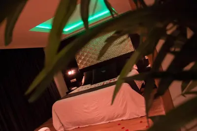 a bedroom with a bed with a laptop on it at Motel Paraiso in Outeiro de Rei