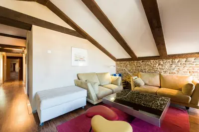 a living room with a couch and a table at Posada Real de Las Misas in Puebla de Sanabria