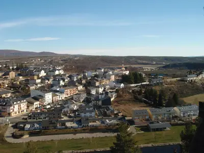 an aerial view of a small town with houses at Posada Real de Las Misas in Puebla de Sanabria