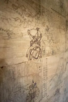 a drawing of a compass on top of a map at El Pinar in Ribadeo