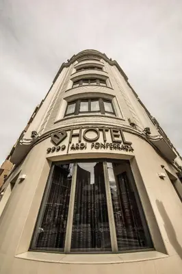 a building with a sign on the top of it at Hotel Aroi Ponferrada in Ponferrada