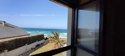 a view of the ocean from a window at Hotel Balcón de San Bartolo in Barreiros