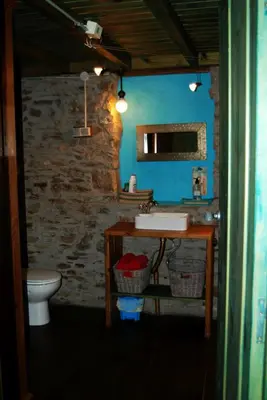 a bathroom with a sink and a toilet at MIL MADREÑAS ROJAS in Salientes