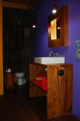 a bathroom with a sink and a toilet and a mirror at MIL MADREÑAS ROJAS in Salientes