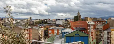 a view of a city with many buildings at San Miguel in Ponferrada