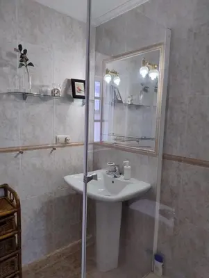 a bathroom with a sink and a mirror at Casa Bartulo in Castrofeito
