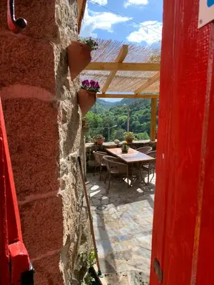a view of a patio from the door of a house at O Remanso Dos Patos in Penalba