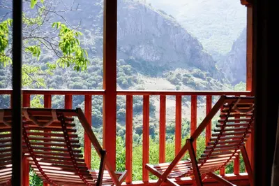 a window with a view of a mountain view at Fogar Mozárabe in Peñalba de Santiago