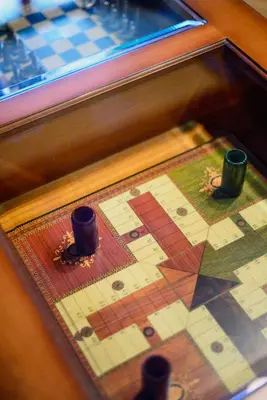 a close up of a chess board with two cups at A Casoa in Santa Eulalia de Oscos