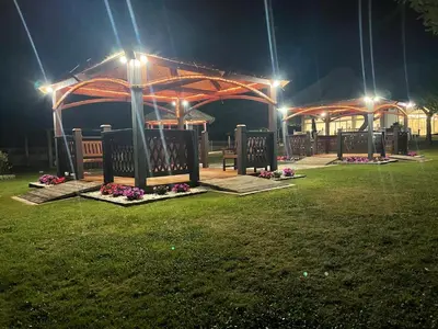 a park with a pavilion at night with lights at Hostal La Casilla in Guitiriz