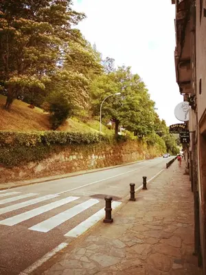 a street with a crosswalk on the side of a road at Hostal As Margaritas in Santiago de Compostela
