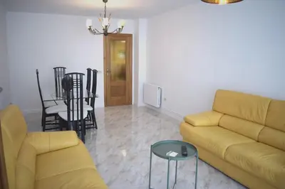 a living room with a couch and a table at La Casa de Manuel in Portomarin