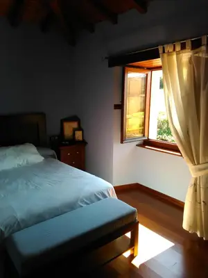 a bedroom with a bed and a window at Casa Rural Oza dos Ríos in Oza dos Ríos