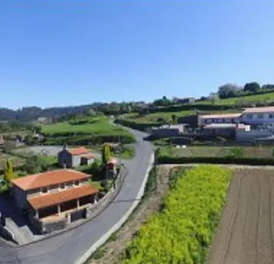 an aerial view of a road leading to a building at Casa Rural Oza dos Ríos in Oza dos Ríos