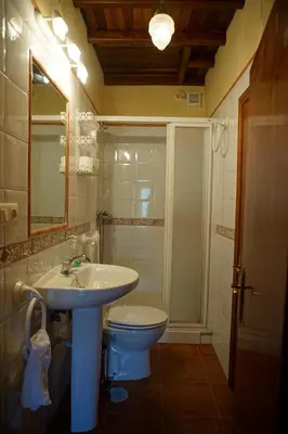 a bathroom with a sink and a toilet at Casa Maricuelo in Castropol