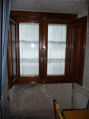 a cabinet with two glass windows in a room at Hortas P.R. in Santiago de Compostela