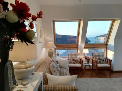 a living room with a couch and chairs and windows at San Ciprian Atico Playa by I Love Norte in San Ciprián