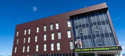 a brown building with a sign on the side of it at Hotel Ciudad de Ponferrada, Ascend Hotel Collection in Ponferrada
