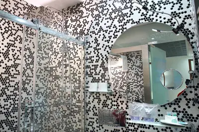 a bedroom with a white bed and a large mirror at Casas Reais Boutique in Santiago de Compostela