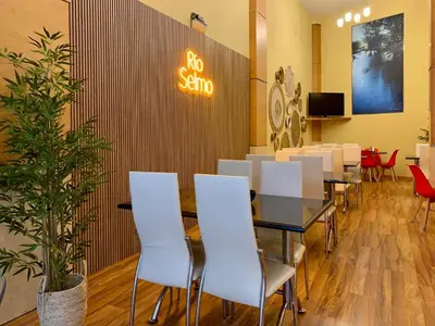 a dining room with a no sign on the wall at Hostal RIO SELMO in Ponferrada