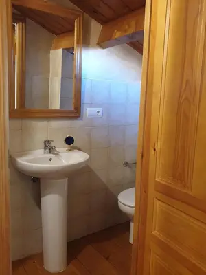 a bathroom with a sink and a toilet at La Casina de Terobe in Cacabelos