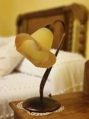 a statue of a bird lamp on a table at La Casina de Terobe in Cacabelos