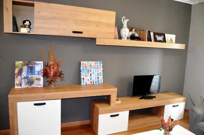 a living room with a desk and a tv at REGO DA RAÑA APARTMENTS in Arzúa